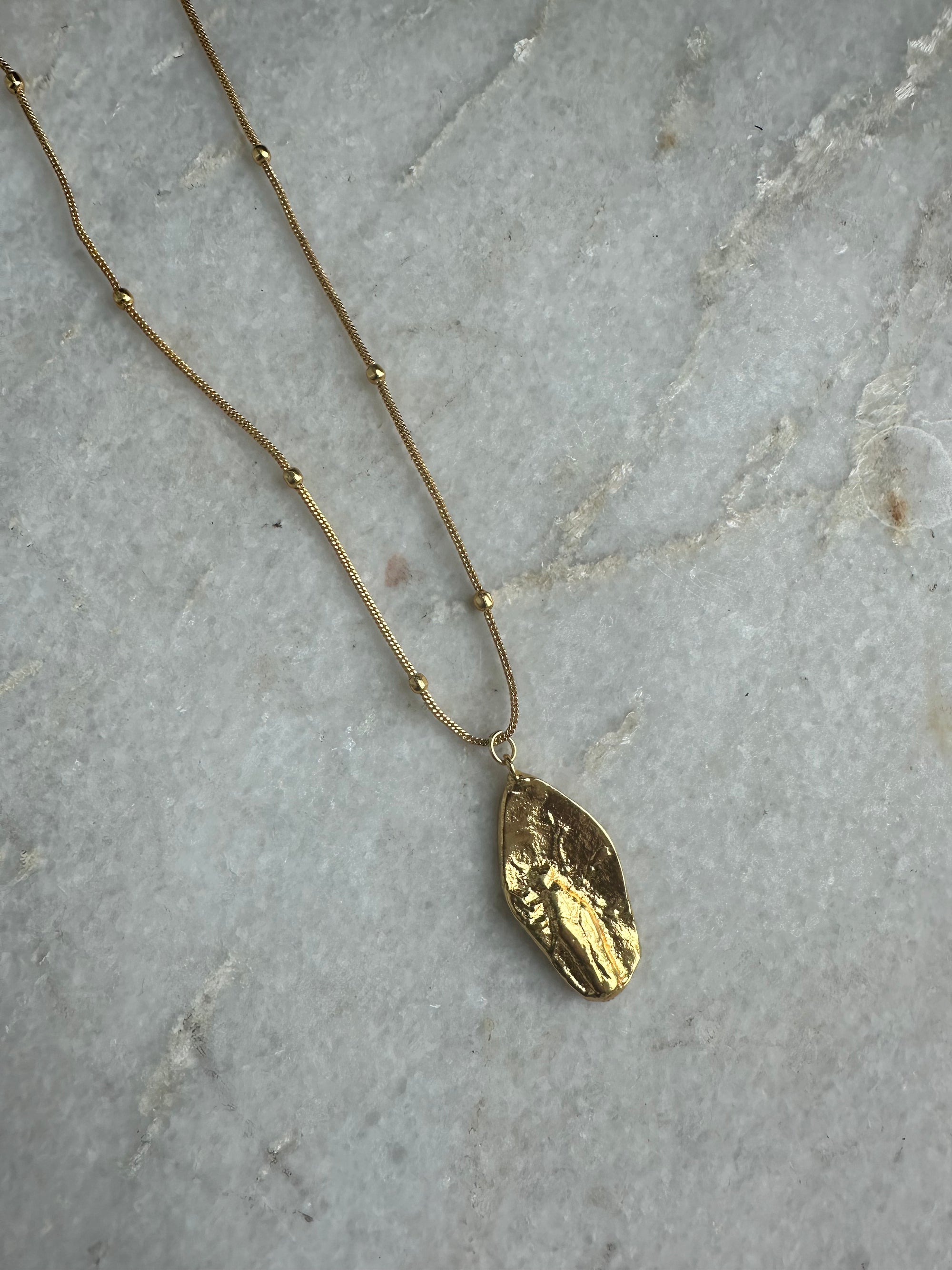Oblong Fossil Gold Necklace